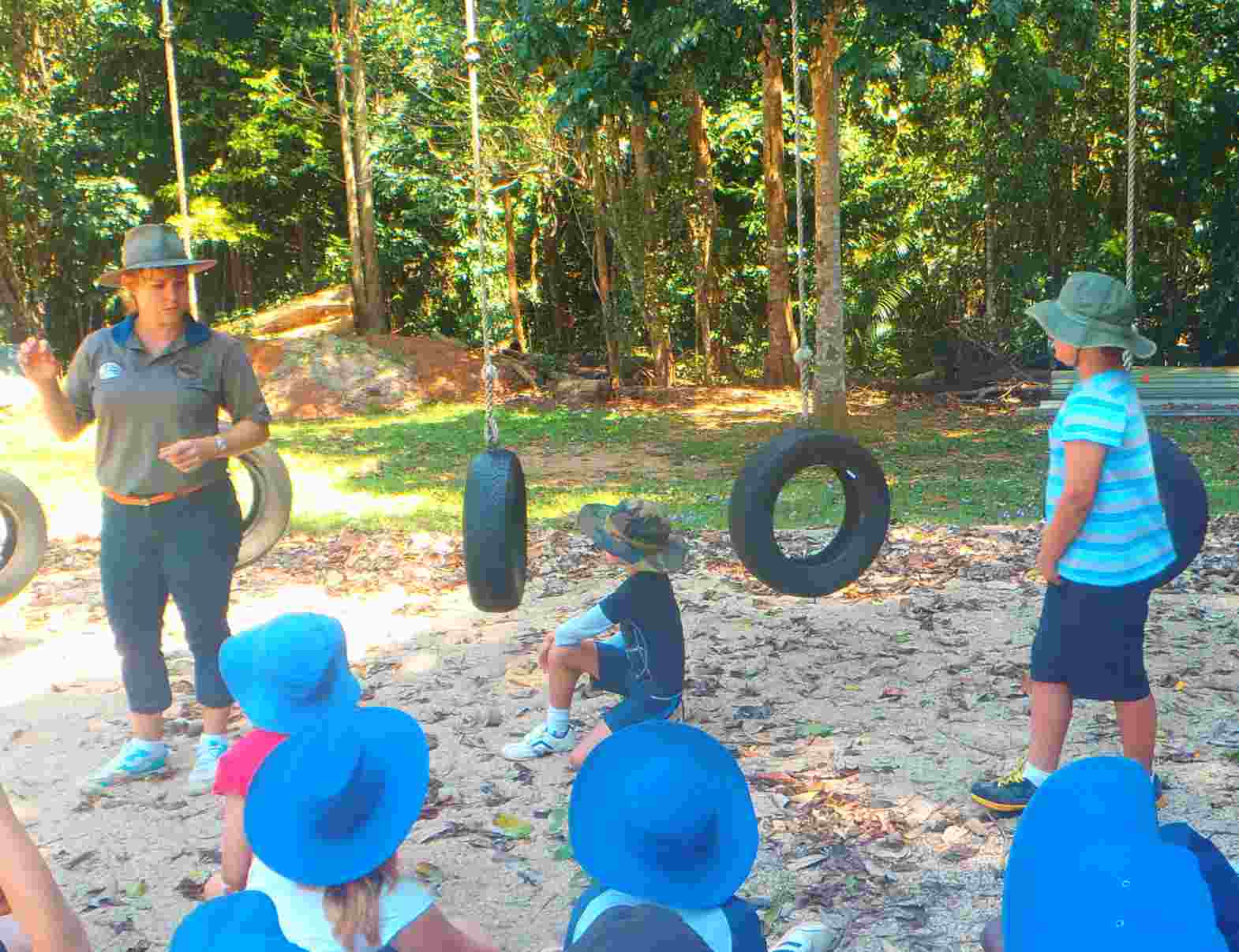 students with teacher on outdoor course