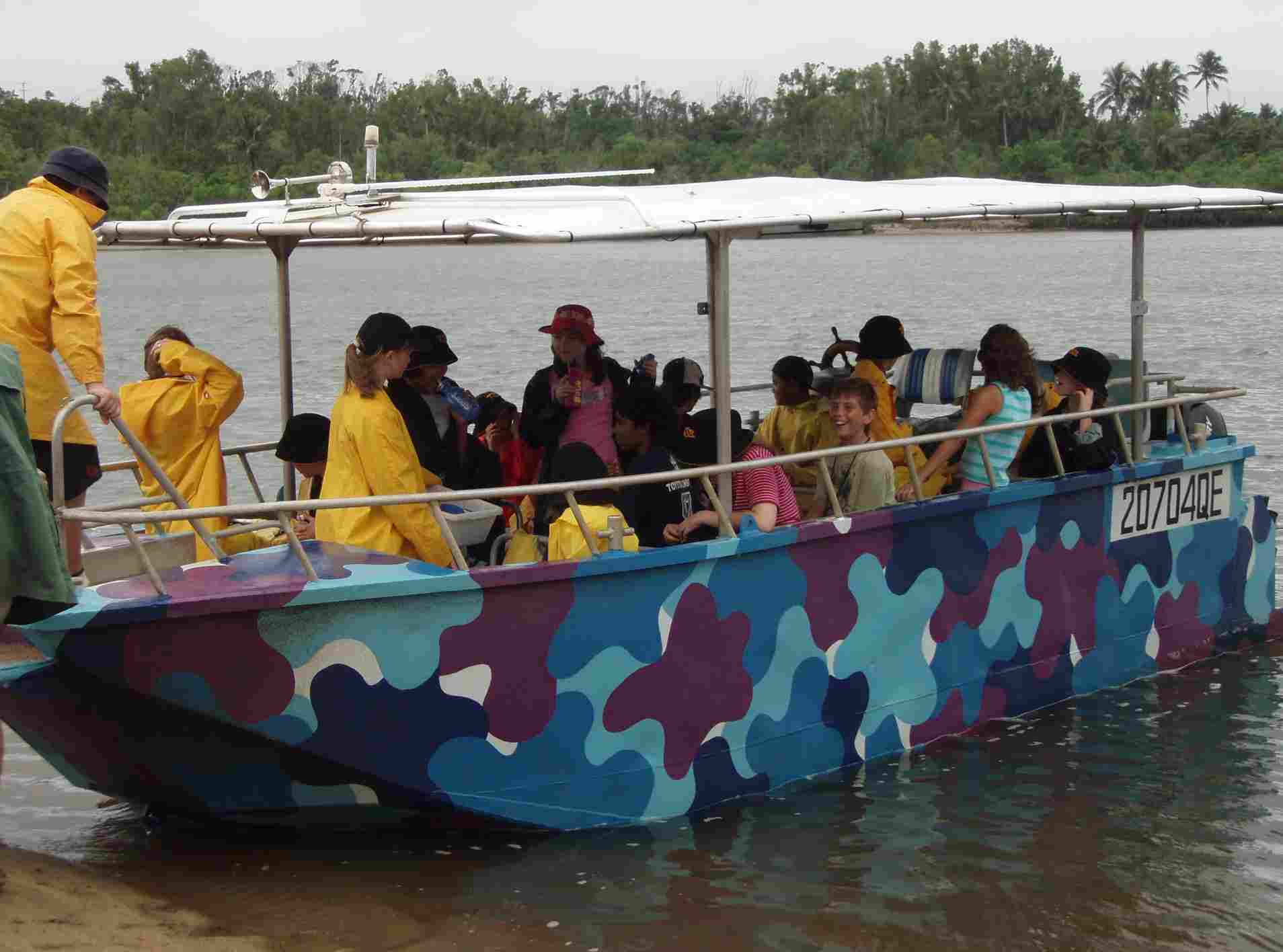 students in boat on water